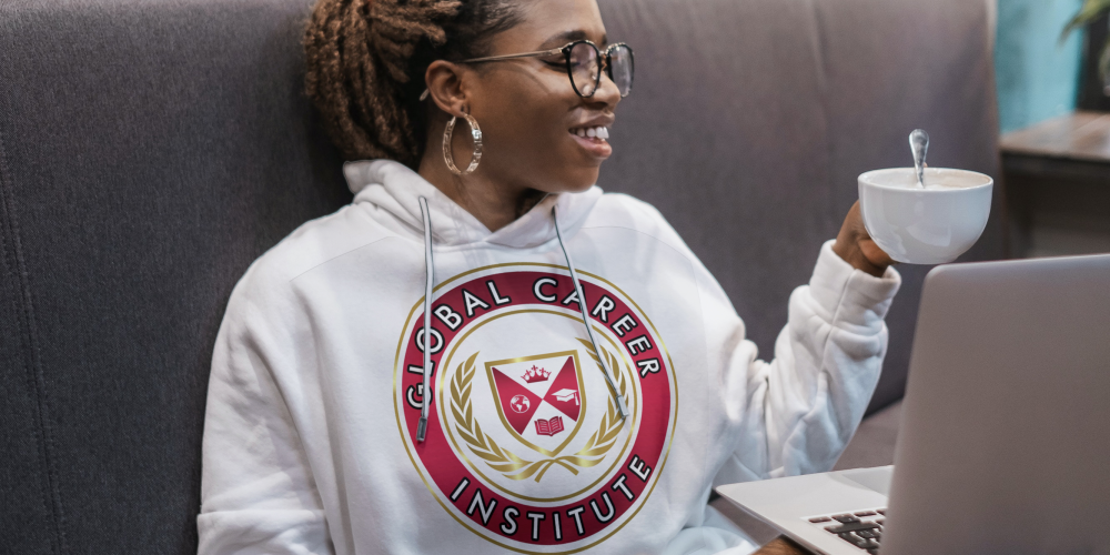 African-American woman with glasses wearing a hoodie in the cafe_gci logo (1)
